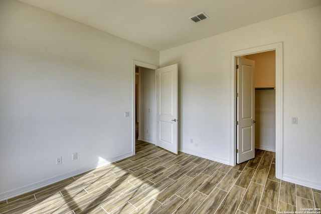23350 Grande Vis, San Antonio, TX 78261 - unfurnished bedroom with wood finished floors and baseboards