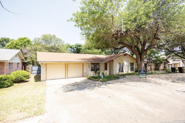 7035 Forest Mdw, San Antonio, TX 78240 - single story home featuring an attached garage, brick siding, and concrete driveway