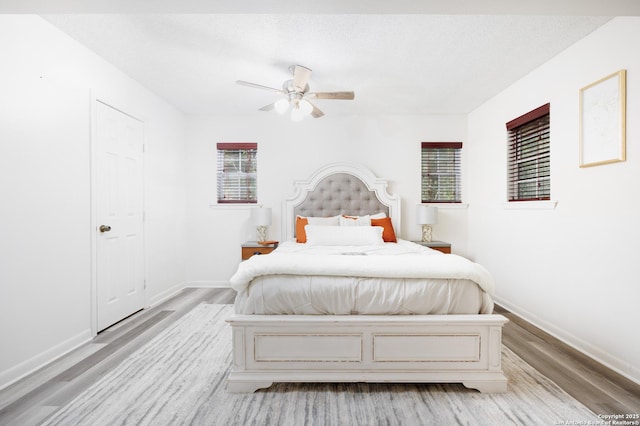 7035 Forest Mdw, San Antonio, TX 78240 - bedroom with light wood-style floors, baseboards, and a ceiling fan