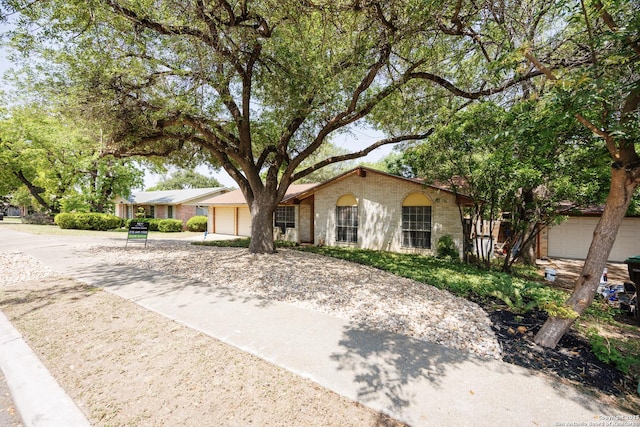 7035 Forest Mdw, San Antonio, TX 78240 - ranch-style house with an attached garage and driveway