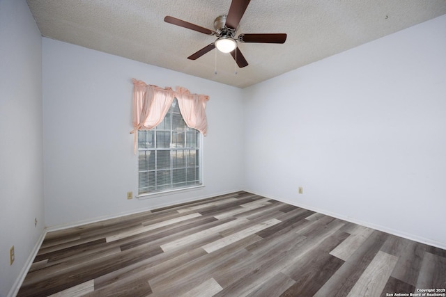 7035 Forest Mdw, San Antonio, TX 78240 - empty room featuring wood finished floors, a ceiling fan, a textured ceiling, and baseboards
