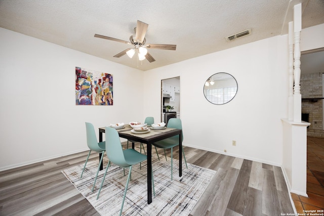 7035 Forest Mdw, San Antonio, TX 78240 - dining space with ceiling fan, wood finished floors, a textured ceiling, and baseboards