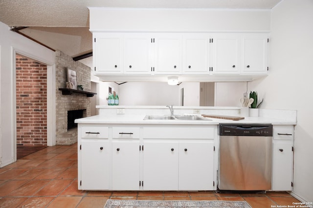 7035 Forest Mdw, San Antonio, TX 78240 - kitchen featuring stainless steel dishwasher, a sink, brick wall, white cabinets, and a fireplace