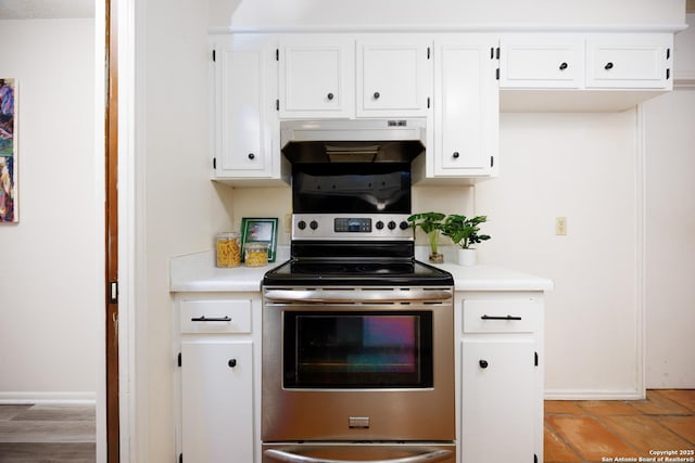 7035 Forest Mdw, San Antonio, TX 78240 - kitchen featuring electric stove, under cabinet range hood, light countertops, and white cabinetry