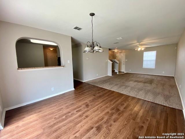 6926 Lunar Way, San Antonio, TX 78109 - unfurnished living room featuring ceiling fan, baseboards, a chandelier, wood finished floors, and stairs