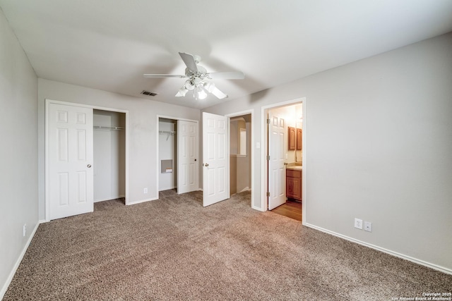 6926 Lunar Way, San Antonio, TX 78109 - unfurnished bedroom featuring two closets, light carpet, baseboards, connected bathroom, and ceiling fan
