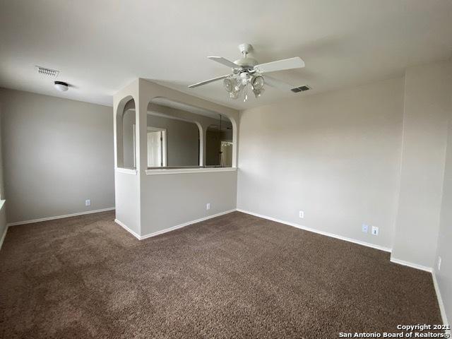 6926 Lunar Way, San Antonio, TX 78109 - unfurnished room with ceiling fan, dark carpet, and baseboards