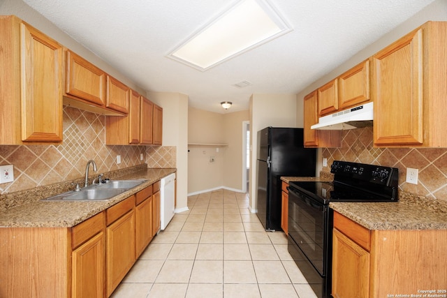 3702 Candlebluff, San Antonio, TX 78244 - kitchen featuring black appliances, under cabinet range hood, a sink, light tile patterned floors, and tasteful backsplash