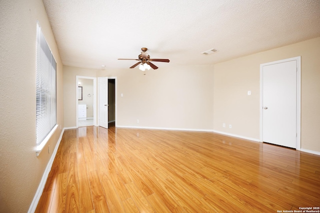 3702 Candlebluff, San Antonio, TX 78244 - spare room with a ceiling fan, light wood-style floors, and baseboards