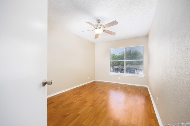 3702 Candlebluff, San Antonio, TX 78244 - unfurnished room featuring a ceiling fan, light wood finished floors, baseboards, and a textured ceiling