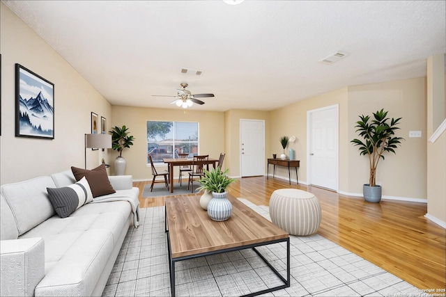 3702 Candlebluff, San Antonio, TX 78244 - living room featuring light wood-style floors, a ceiling fan, and baseboards