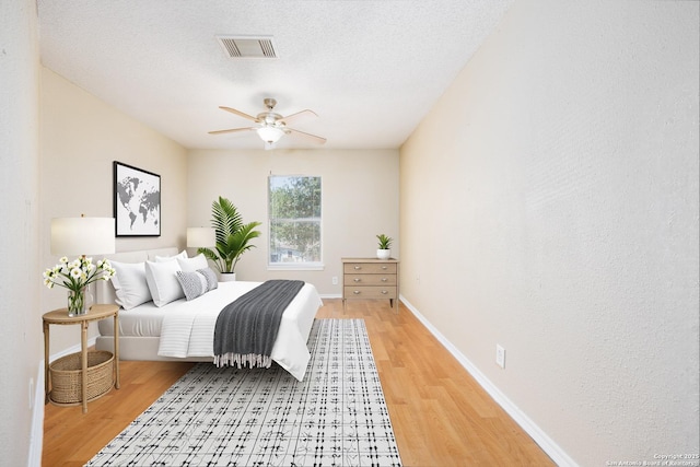 3702 Candlebluff, San Antonio, TX 78244 - bedroom with light wood-type flooring, baseboards, and ceiling fan