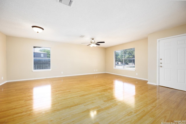 3702 Candlebluff, San Antonio, TX 78244 - spare room featuring light wood-style floors, ceiling fan, and baseboards