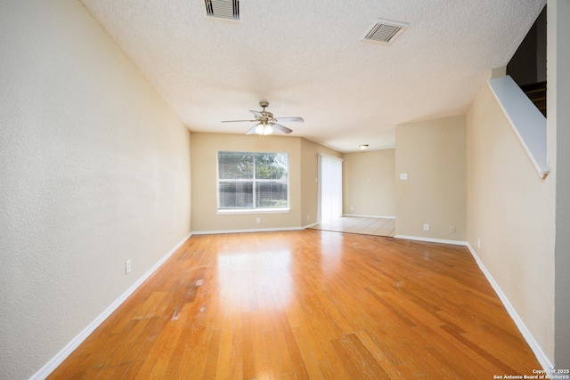 3702 Candlebluff, San Antonio, TX 78244 - spare room with ceiling fan, light wood finished floors, a textured ceiling, and baseboards
