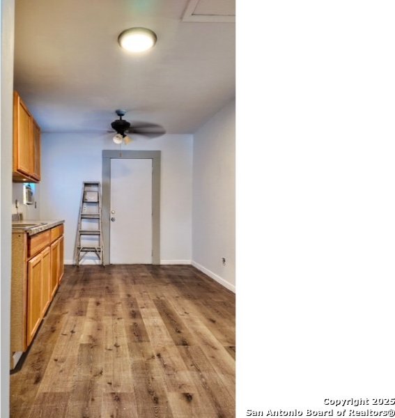 1414 Rivas, San Antonio, TX 78207 - kitchen featuring light wood-style flooring, baseboards, ceiling fan, light countertops, and a sink