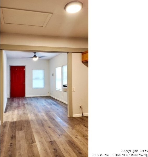 1414 Rivas, San Antonio, TX 78207 - spare room with light wood finished floors, baseboards, a ceiling fan, and attic access