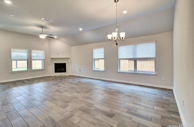 2035 Stephanie Ave, New Braunfels, TX 78132 - unfurnished living room featuring a ceiling fan, lofted ceiling, plenty of natural light, wood finished floors, and recessed lighting