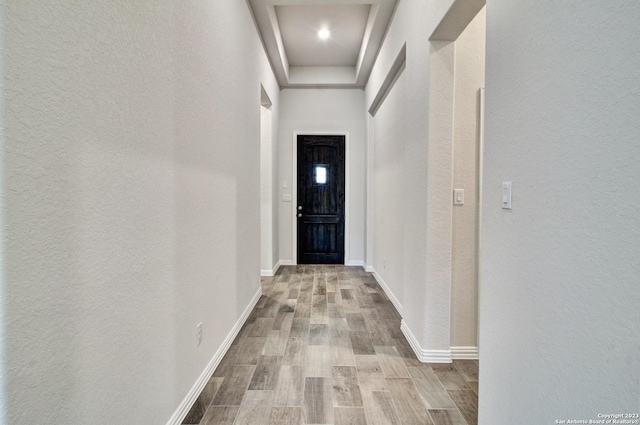 2035 Stephanie Ave, New Braunfels, TX 78132 - doorway to outside featuring wood finished floors, a textured wall, and baseboards
