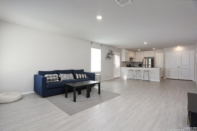 10787 Giacconi, Converse, TX 78109 - living room featuring light wood-style flooring, baseboards, and recessed lighting