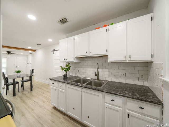 11105 Lone Shadow, Live Oak, TX 78233 - kitchen featuring a sink, decorative backsplash, white cabinetry, and recessed lighting