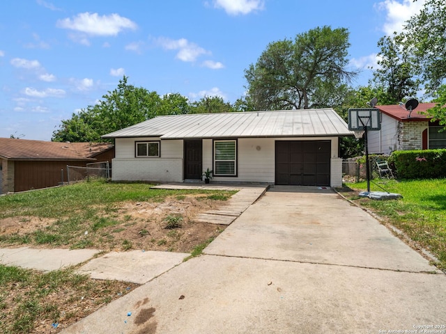 11105 Lone Shadow, Live Oak, TX 78233 - view of front of property with a standing seam roof, a garage, concrete driveway, brick siding, and metal roof
