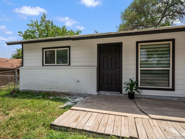 11105 Lone Shadow, Live Oak, TX 78233 - doorway to property with brick siding and a wooden deck