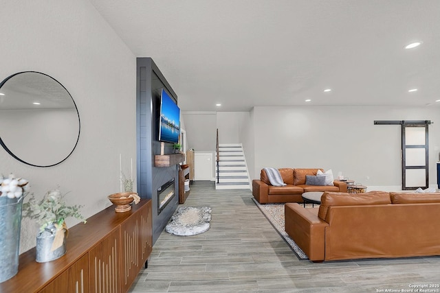 757 Joy, Floresville, TX 78114 - living area featuring a fireplace, light wood-type flooring, recessed lighting, and stairway