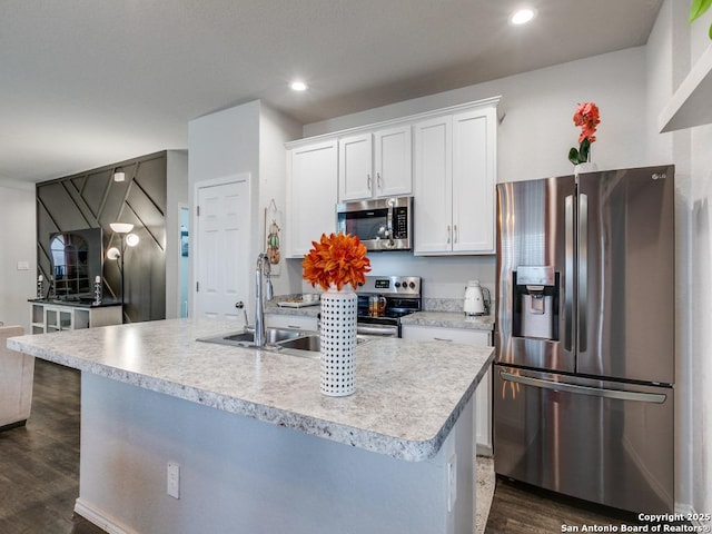 607 Pleasanton Spg, San Antonio, TX 78221 - kitchen featuring appliances with stainless steel finishes, dark wood-style floors, white cabinets, light countertops, and recessed lighting