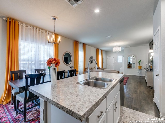 607 Pleasanton Spg, San Antonio, TX 78221 - kitchen featuring a chandelier, a sink, open floor plan, and plenty of natural light