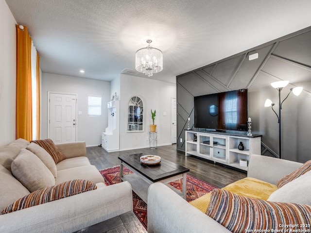 607 Pleasanton Spg, San Antonio, TX 78221 - living area with a chandelier, wood finished floors, and baseboards