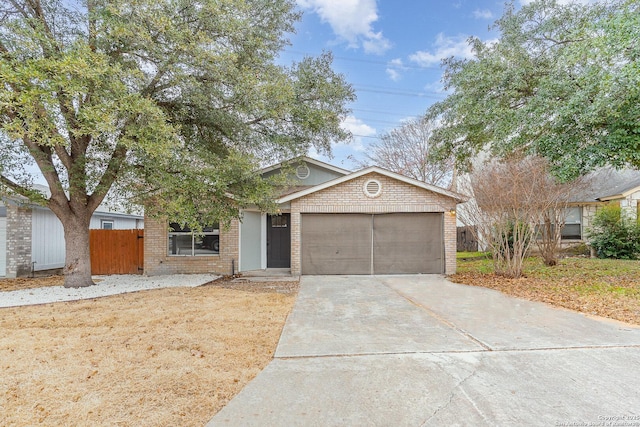 4543 Stradford, San Antonio, TX 78217 - view of front of home featuring driveway, an attached garage, and brick siding