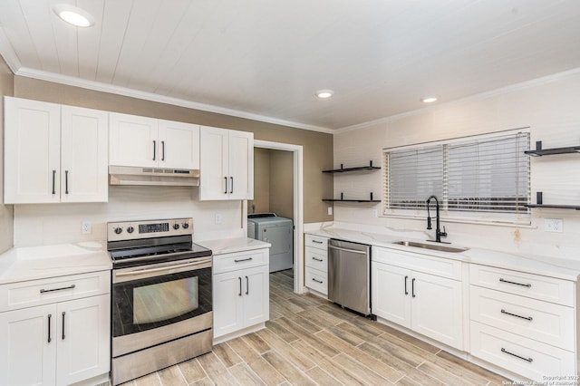 4543 Stradford, San Antonio, TX 78217 - kitchen with appliances with stainless steel finishes, open shelves, under cabinet range hood, separate washer and dryer, and ornamental molding