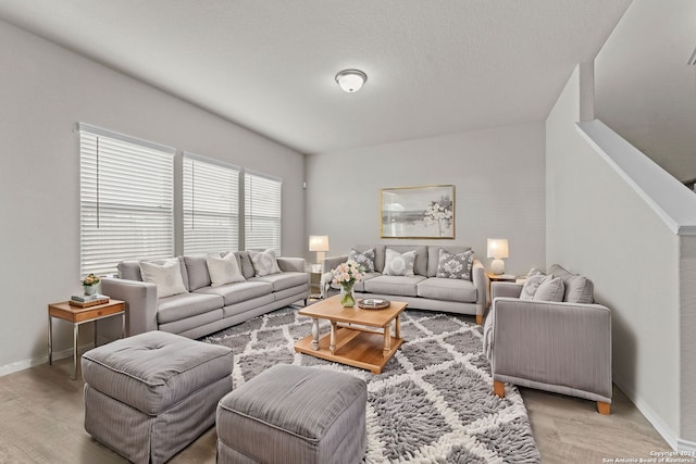 7115 Mesa Clfs, Converse, TX 78109 - living area featuring light wood-style flooring and baseboards