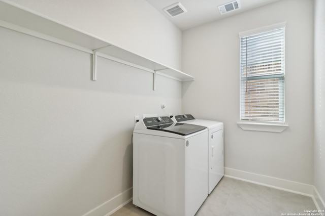 11554 Cottage Pt, San Antonio, TX 78254 - laundry area with washer and dryer, baseboards, and healthy amount of natural light