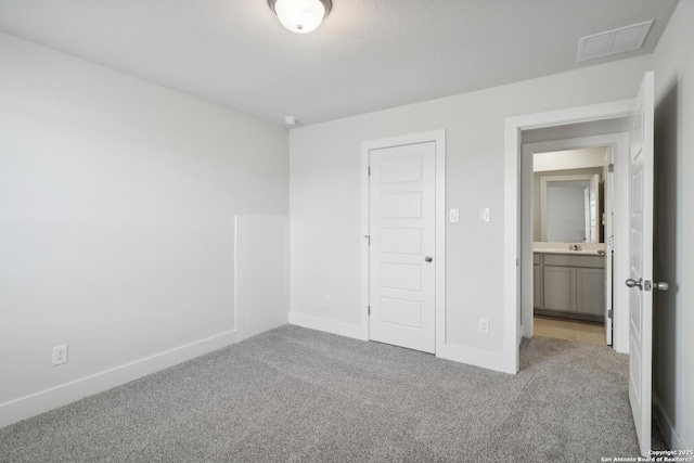 11554 Cottage Pt, San Antonio, TX 78254 - unfurnished bedroom with carpet flooring, baseboards, and a sink