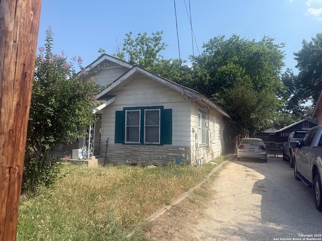 924 Santa Monica, San Antonio, TX 78201 - view of home's exterior featuring stone siding and driveway
