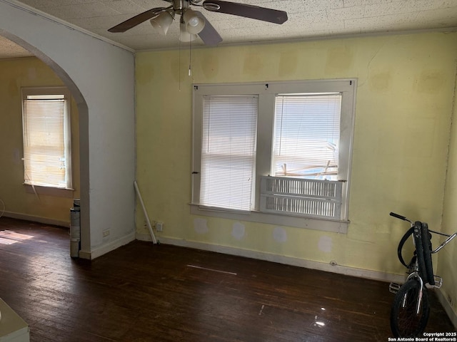924 Santa Monica, San Antonio, TX 78201 - spare room with arched walkways, wood-type flooring, a ceiling fan, and healthy amount of natural light