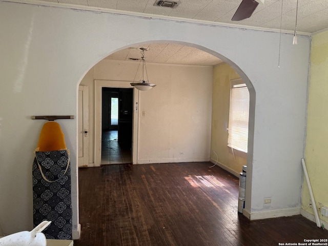 924 Santa Monica, San Antonio, TX 78201 - unfurnished dining area with hardwood / wood-style flooring, baseboards, and arched walkways