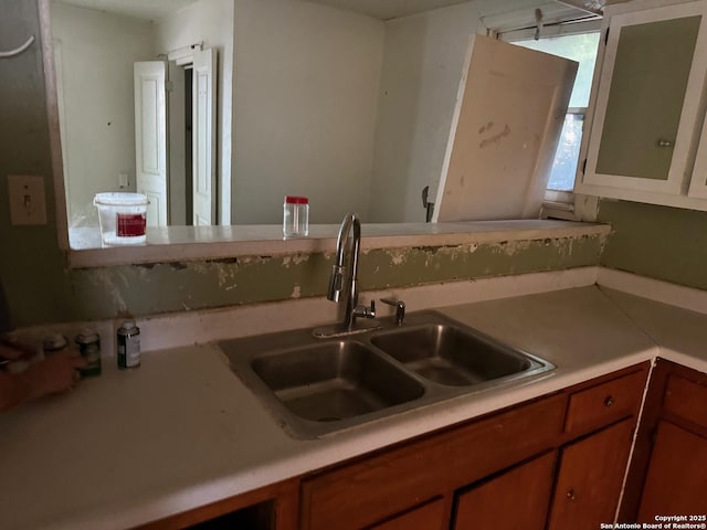 924 Santa Monica, San Antonio, TX 78201 - kitchen with a sink, light countertops, and brown cabinets