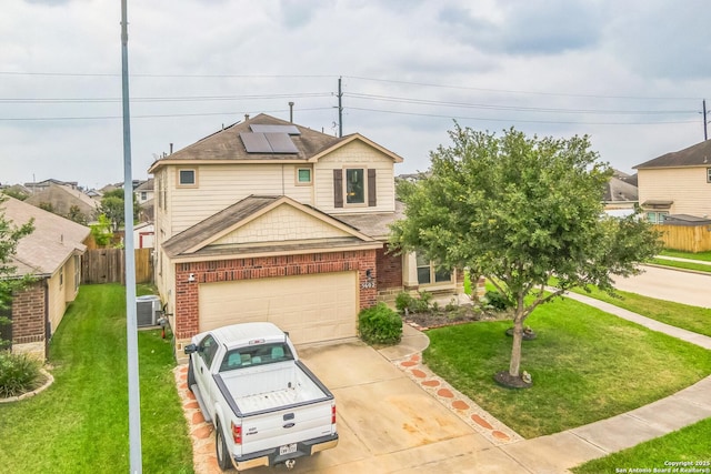 5602 Casa Martin, Katy, TX 77449 - view of front of house with brick siding, solar panels, concrete driveway, and a garage
