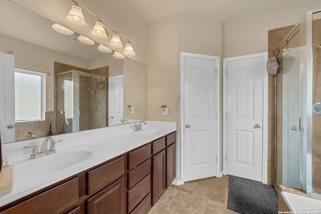 5602 Casa Martin, Katy, TX 77449 - bathroom featuring a stall shower, double vanity, and tile patterned floors