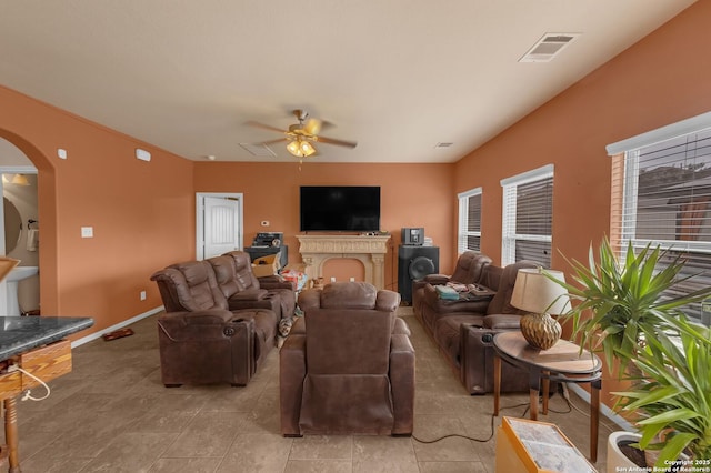 5602 Casa Martin, Katy, TX 77449 - living room with arched walkways, ceiling fan, and baseboards