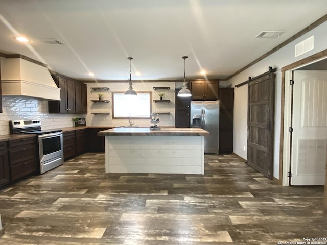1727 Fm 1346, La Vernia, TX 78121 - kitchen with stainless steel appliances, open shelves, premium range hood, dark brown cabinets, and recessed lighting