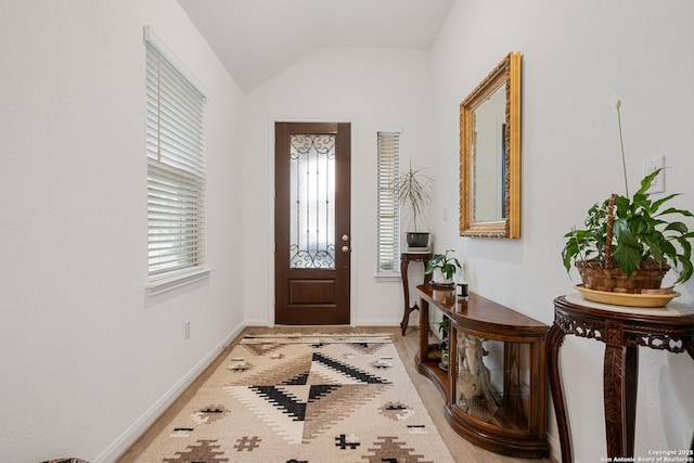 10128 Bussang, Schertz, TX 78154 - foyer entrance with lofted ceiling, light wood-style floors, and baseboards