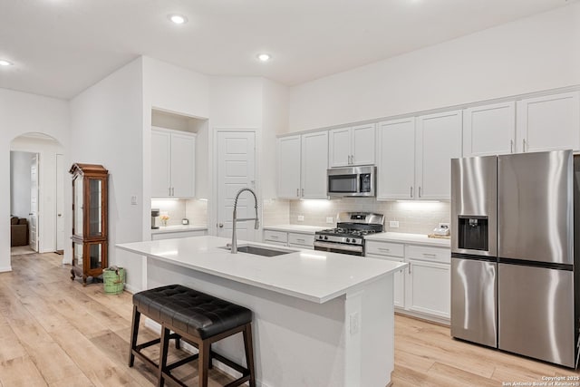 10128 Bussang, Schertz, TX 78154 - kitchen featuring appliances with stainless steel finishes, a sink, arched walkways, backsplash, and recessed lighting