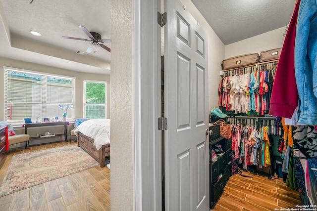 9927 Sandy Fld, San Antonio, TX 78245 - walk in closet with wood finished floors and a ceiling fan