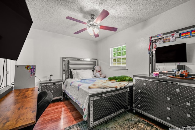 9927 Sandy Fld, San Antonio, TX 78245 - bedroom with wood finished floors, a textured ceiling, and ceiling fan