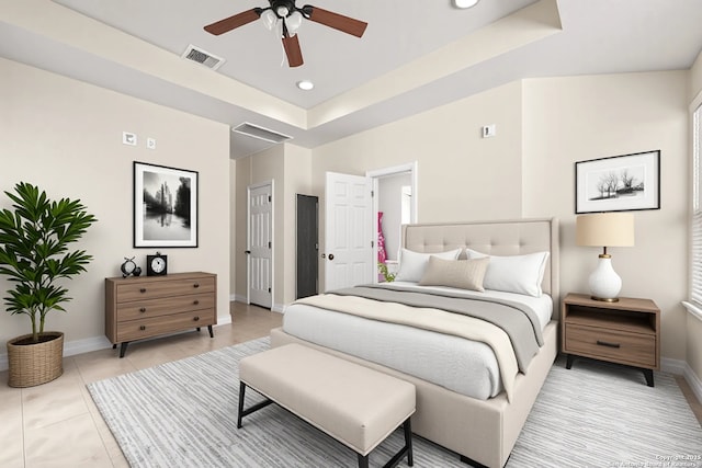 9927 Sandy Fld, San Antonio, TX 78245 - bedroom with baseboards, a tray ceiling, recessed lighting, light tile patterned floors, and a ceiling fan