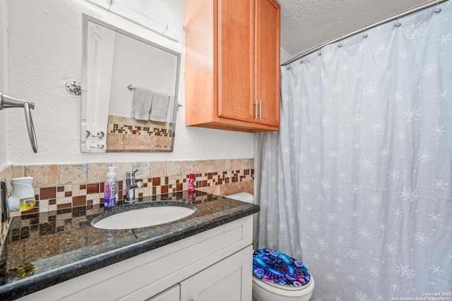 9927 Sandy Fld, San Antonio, TX 78245 - full bath with vanity, tile walls, toilet, a textured ceiling, and a shower with curtain