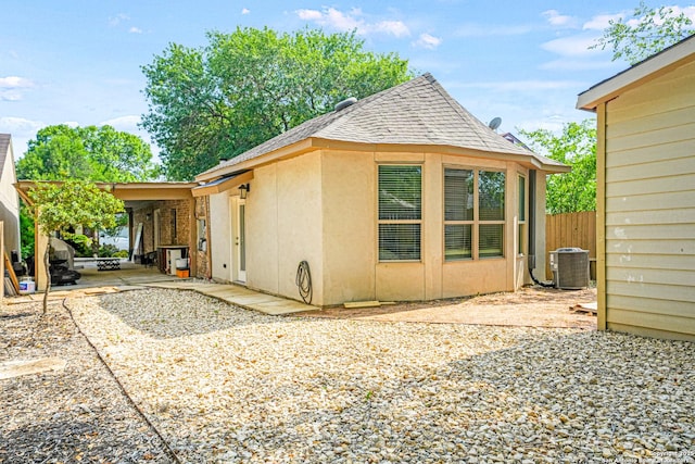 9927 Sandy Fld, San Antonio, TX 78245 - view of side of home featuring central AC and roof with shingles